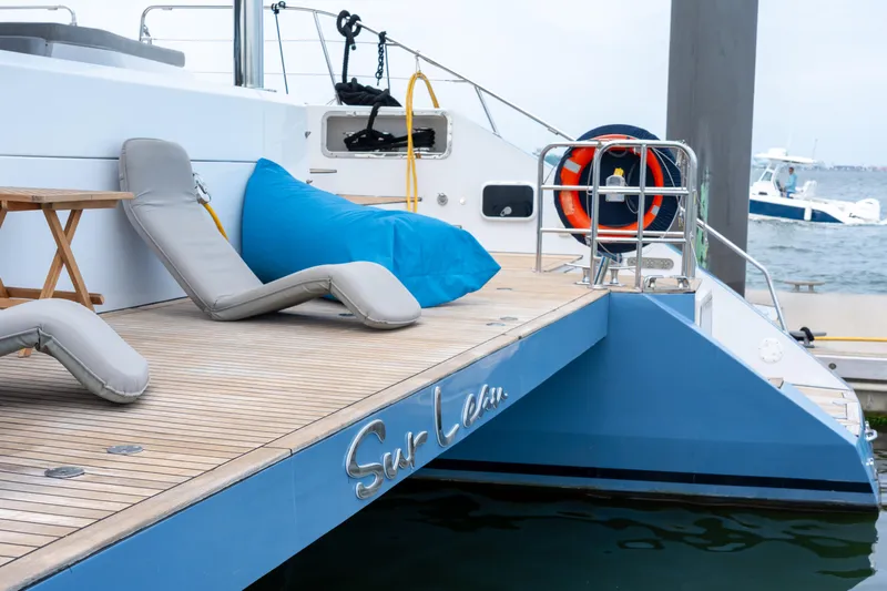 Sur L'eau Yacht Photos Pics Luxury yacht deck with lounge chairs and a blue bean bag, Privilege 745, 2008 model.