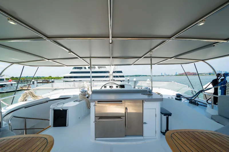 Sur L'eau Yacht Photos Pics Luxurious 2008 Privilege 745 yacht deck with modern amenities and ocean view.