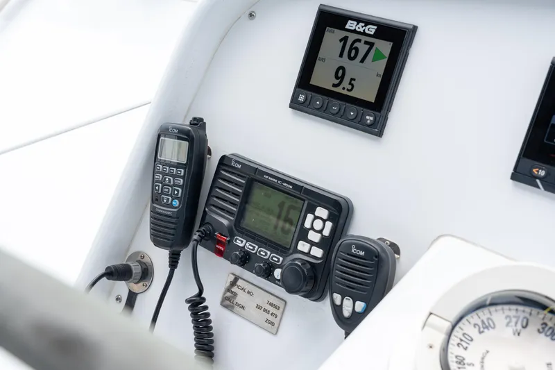Sur L'eau Yacht Photos Pics Control panel of a 2008 Privilege 745 yacht with communication and navigation equipment.