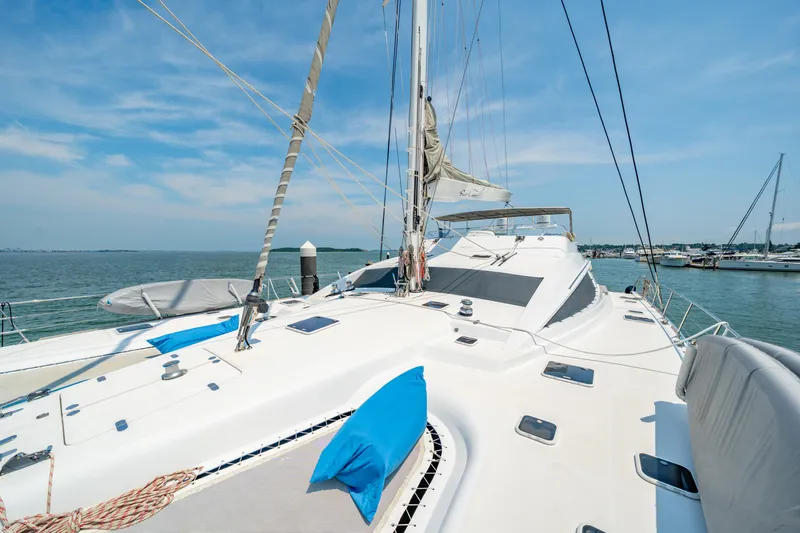 Sur L'eau Yacht Photos Pics Luxury Privilege 745 yacht deck with blue cushions, sailing on a sunny day, 2008 model.