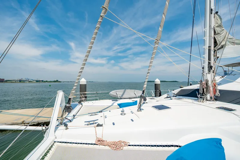 Sur L'eau Yacht Photos Pics Luxury Privilege 745 yacht docked, 2008 model, with clear blue sky and calm waters.