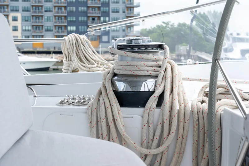 Sur L'eau Yacht Photos Pics Sailing yacht deck with coiled ropes, Privilege 745, 2008 model, marina background.