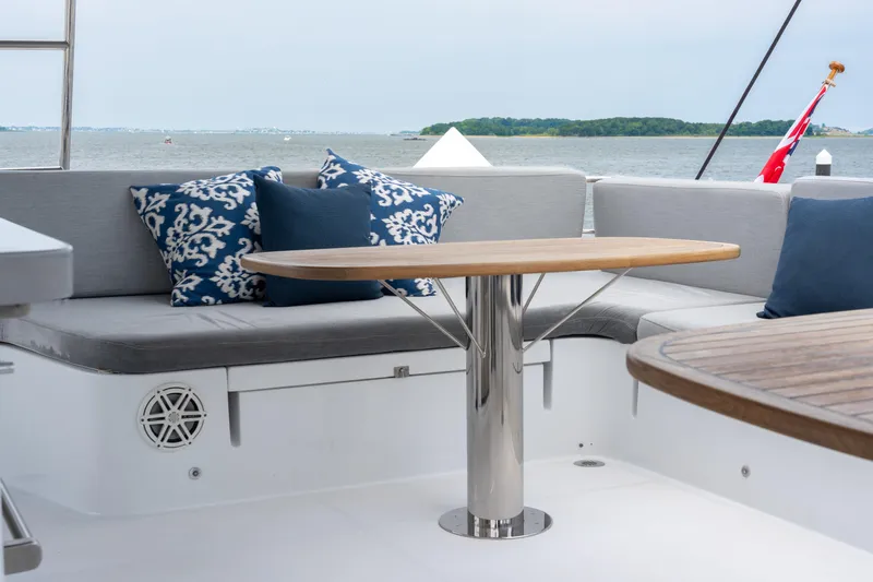 Sur L'eau Yacht Photos Pics Luxury seating area on 2008 Privilege 745 yacht with stylish cushions and table.