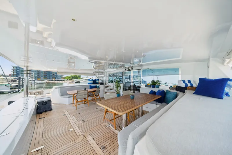 Sur L'eau Yacht Photos Pics Luxurious 2008 Privilege 745 yacht deck with elegant seating and dining area.