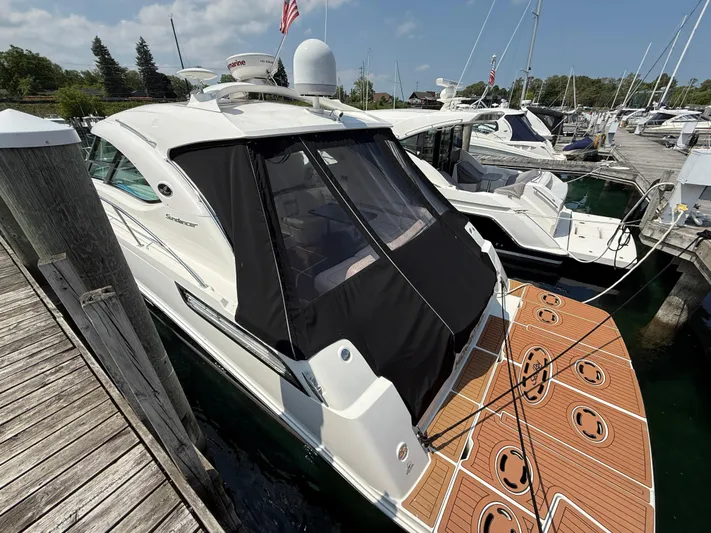 Midnight Run Yacht Photos Pics 2009 Sea Ray 43 Sundancer yacht docked at marina with covered deck.