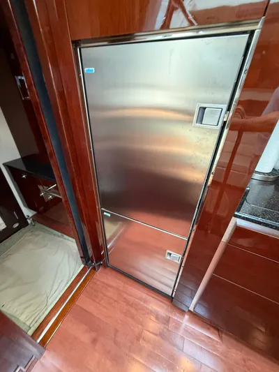 Midnight Run Yacht Photos Pics Stainless steel refrigerator in 2009 Sea Ray 43 Sundancer yacht interior.