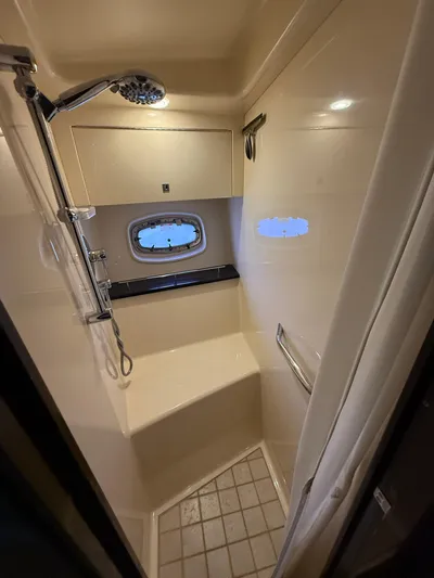 Midnight Run Yacht Photos Pics Shower area in 2009 Sea Ray 43 Sundancer yacht with window and modern fixtures.