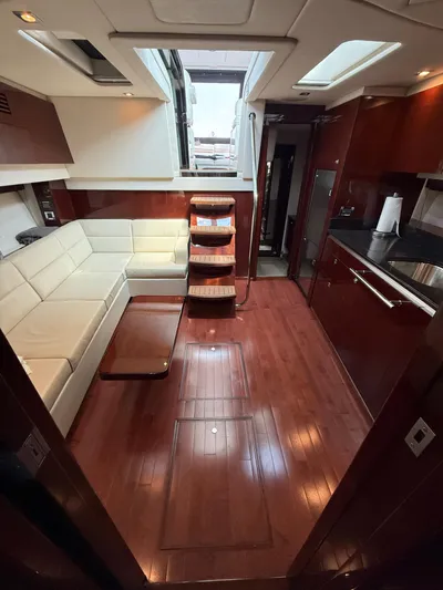 Midnight Run Yacht Photos Pics Luxurious interior of 2009 Sea Ray 43 Sundancer yacht with elegant wood flooring.
