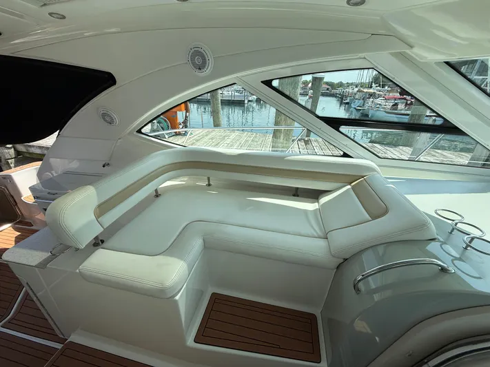 Midnight Run Yacht Photos Pics Luxurious interior of 2009 Sea Ray 43 Sundancer yacht with white seating and wood accents.