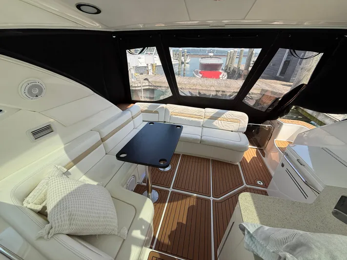 Midnight Run Yacht Photos Pics Luxurious interior of 2009 Sea Ray 43 Sundancer yacht with elegant seating and table.