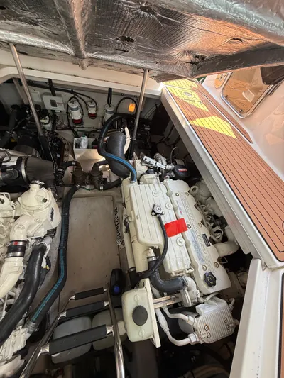 Midnight Run Yacht Photos Pics Engine compartment of 2009 Sea Ray 43 Sundancer, showcasing detailed mechanical components.