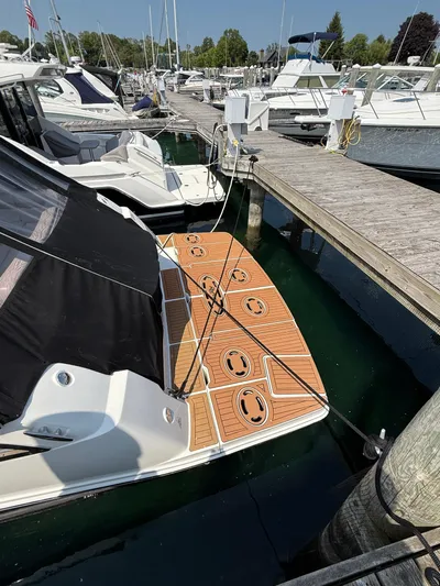 Midnight Run Yacht Photos Pics 2009 Sea Ray 43 Sundancer docked at marina with wooden deck.