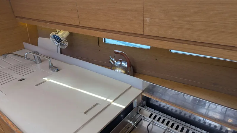 Nevis Yacht Photos Pics Modern kitchen area in 2017 Dufour 460 Grand Large yacht with sink and kettle.