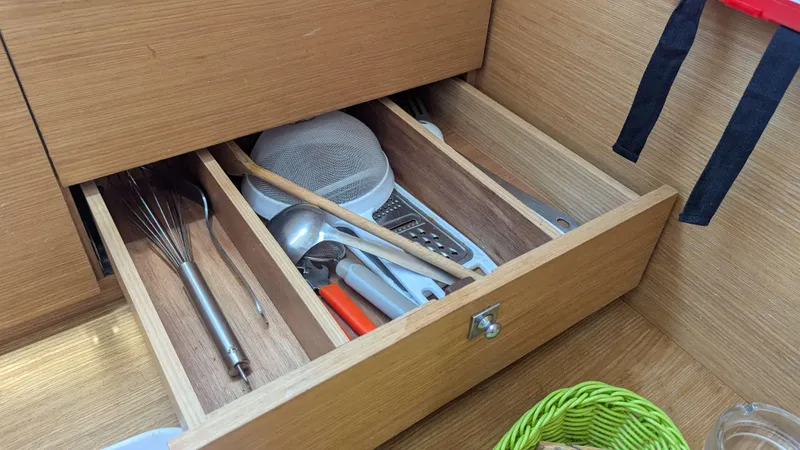 Nevis Yacht Photos Pics Open kitchen drawer with utensils on a 2017 Dufour 460 Grand Large yacht.