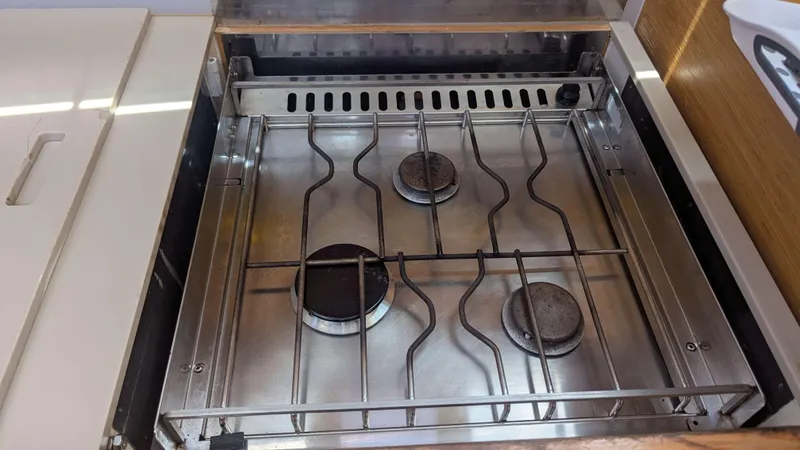 Nevis Yacht Photos Pics Stainless steel stove with three burners on a 2017 Dufour 460 Grand Large yacht.