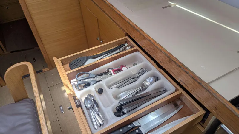 Nevis Yacht Photos Pics Open kitchen drawer with utensils on a 2017 Dufour 460 Grand Large yacht.