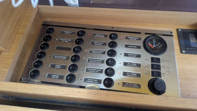 Nevis Yacht Photos Pics Control panel of a 2017 Dufour 460 Grand Large yacht with various switches and gauges.