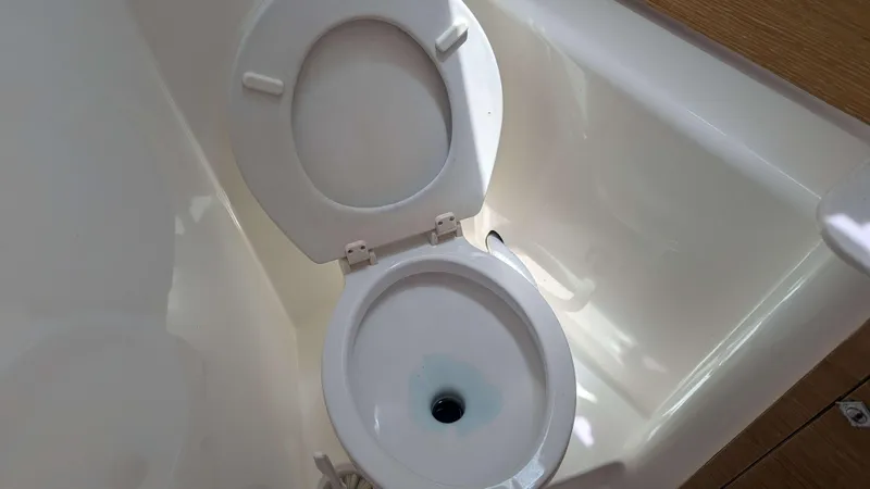 Nevis Yacht Photos Pics Toilet on 2017 Dufour 460 Grand Large yacht, white interior.