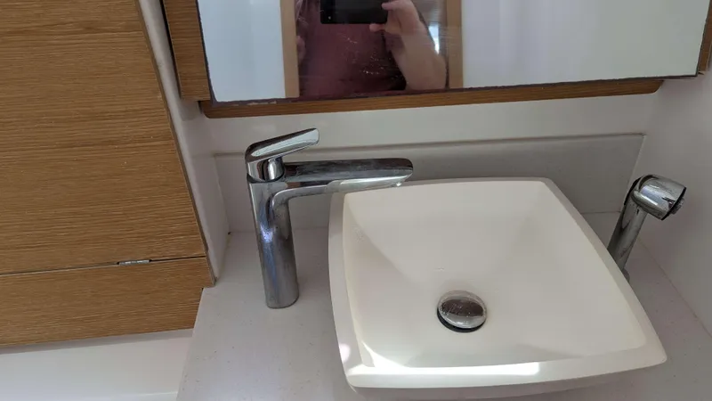 Nevis Yacht Photos Pics Modern bathroom sink and faucet on a 2017 Dufour 460 Grand Large yacht.