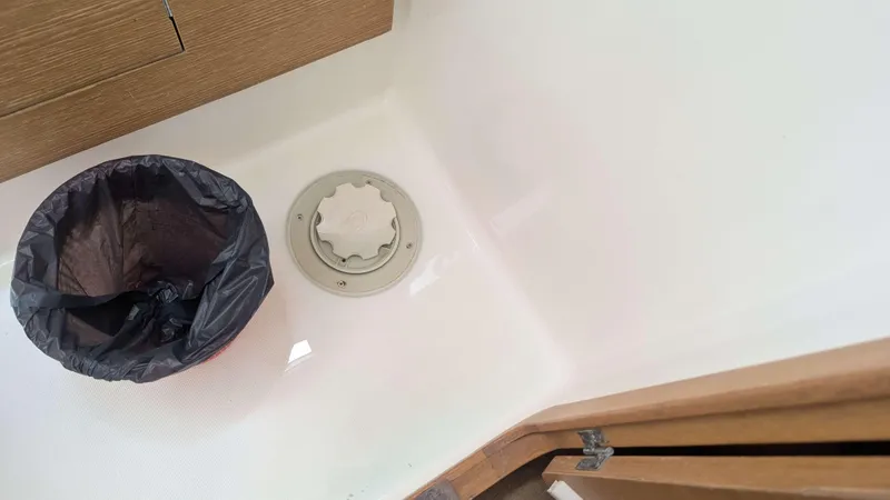 Nevis Yacht Photos Pics Trash bin and hatch in Dufour 460 Grand Large 2017 yacht interior.