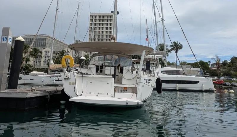 Nevis Yacht Photos Pics Dufour 460 Grand Large 2017 yacht docked at marina, surrounded by other boats.