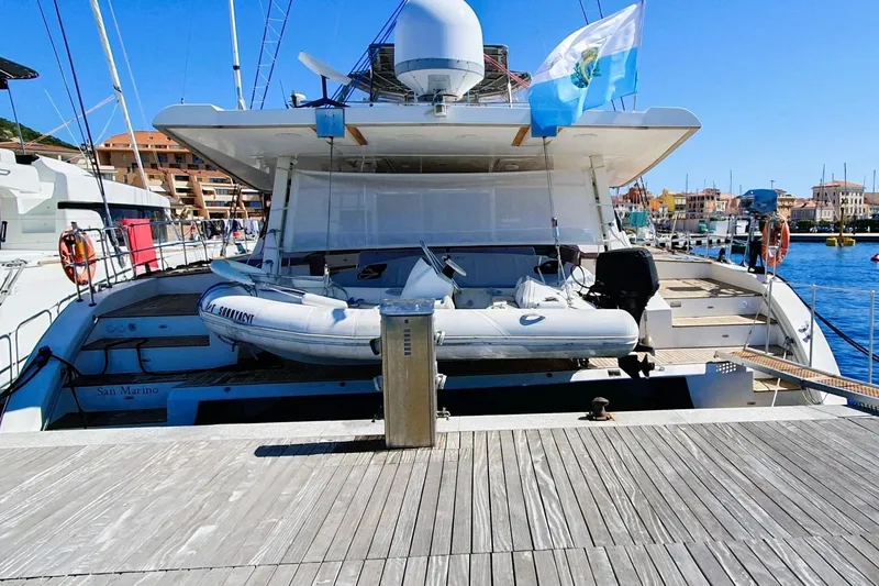 Sunnyacht Yacht Photos Pics Luxury Sunreef 62 yacht docked, featuring a tender boat, 2008 model.