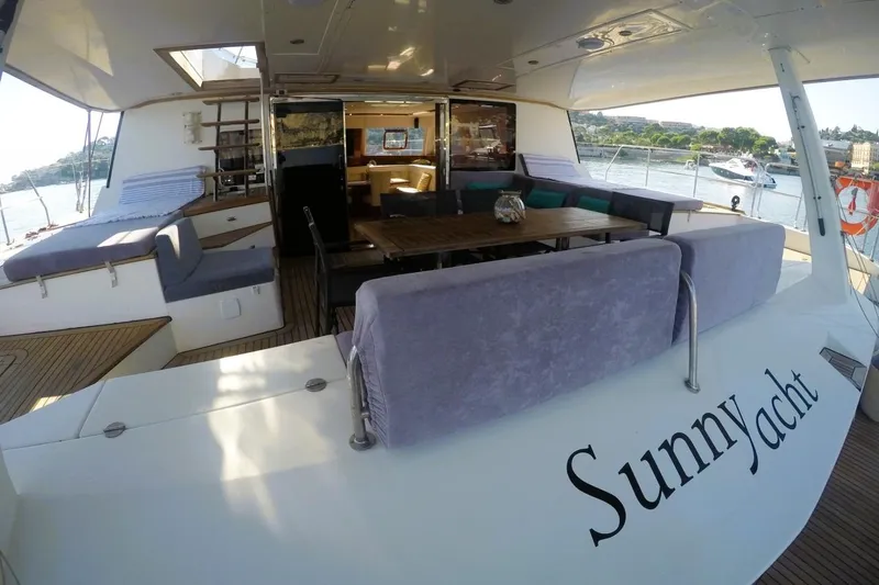 Sunnyacht Yacht Photos Pics Luxurious 2008 Sunreef 62 yacht with spacious deck and elegant seating area.
