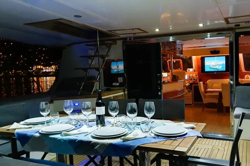 Sunnyacht Yacht Photos Pics Luxurious 2008 Sunreef 62 yacht interior with elegant dining setup and ambient lighting.