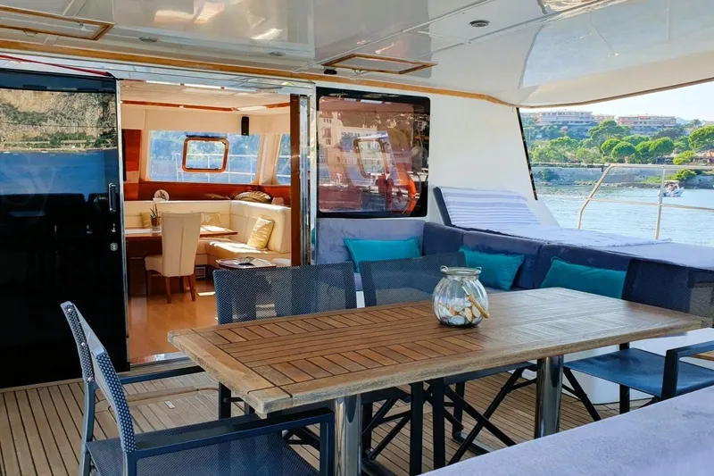 Sunnyacht Yacht Photos Pics Luxurious Sunreef 62 yacht interior and deck, 2008 model, with scenic waterfront view.