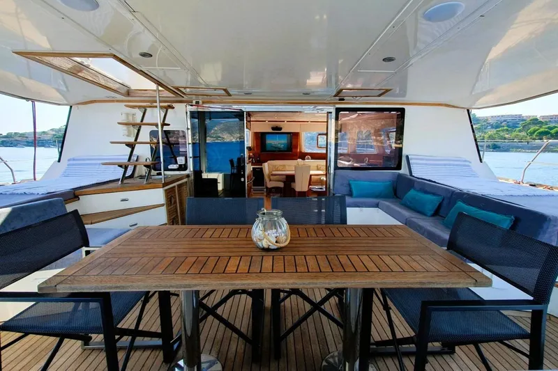 Sunnyacht Yacht Photos Pics Luxurious 2008 Sunreef 62 yacht interior with elegant dining area and scenic ocean view.