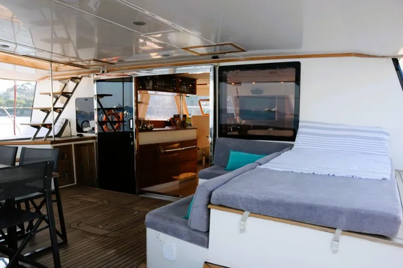 Sunnyacht Yacht Photos Pics Luxurious Sunreef 62 yacht interior, featuring a cozy lounge area and modern kitchen, 2008 model.