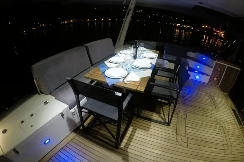 Sunnyacht Yacht Photos Pics Luxurious dining setup on 2008 Sunreef 62 yacht at night.