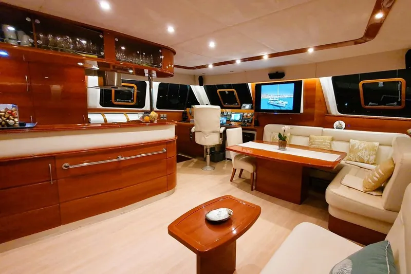 Sunnyacht Yacht Photos Pics Luxurious interior of 2008 Sunreef 62 yacht with elegant wood finishes and modern amenities.