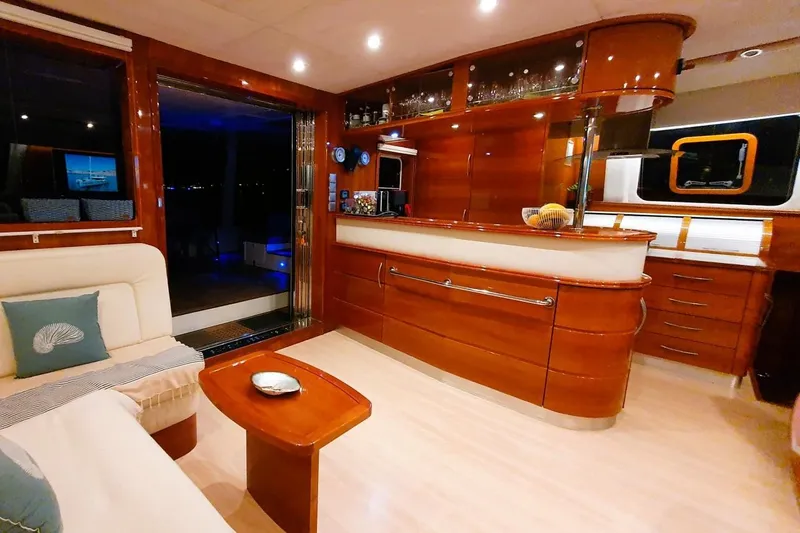 Sunnyacht Yacht Photos Pics Luxurious interior of 2008 Sunreef 62 yacht with elegant wood finishes and modern amenities.