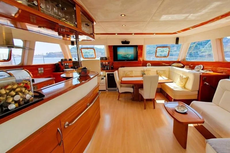 Sunnyacht Yacht Photos Pics Luxurious interior of 2008 Sunreef 62 yacht with elegant seating and panoramic windows.