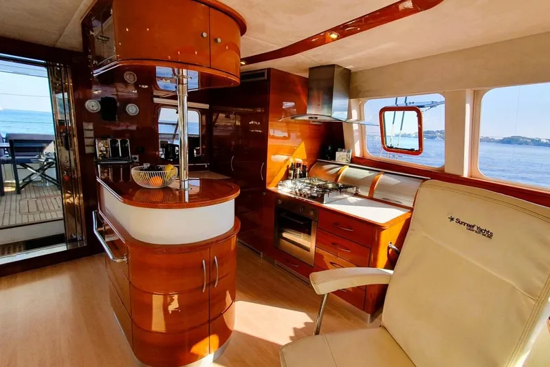 Sunnyacht Yacht Photos Pics Luxurious 2008 Sunreef 62 yacht interior with modern kitchen and ocean view.