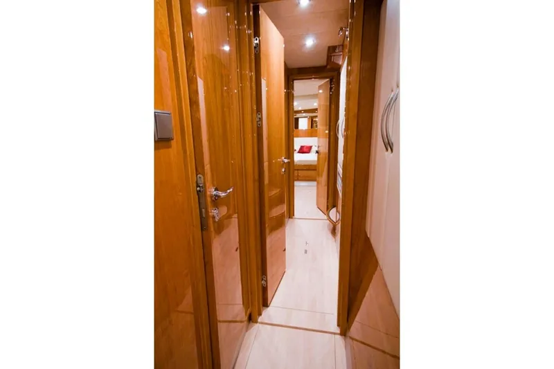 Sunnyacht Yacht Photos Pics Interior hallway of 2008 Sunreef 62 yacht with wooden doors and modern lighting.