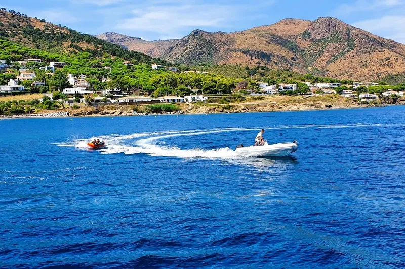 Sunnyacht Yacht Photos Pics Coastal landscape with boats on blue water, Sunreef 62, 2008 model in scenic bay.