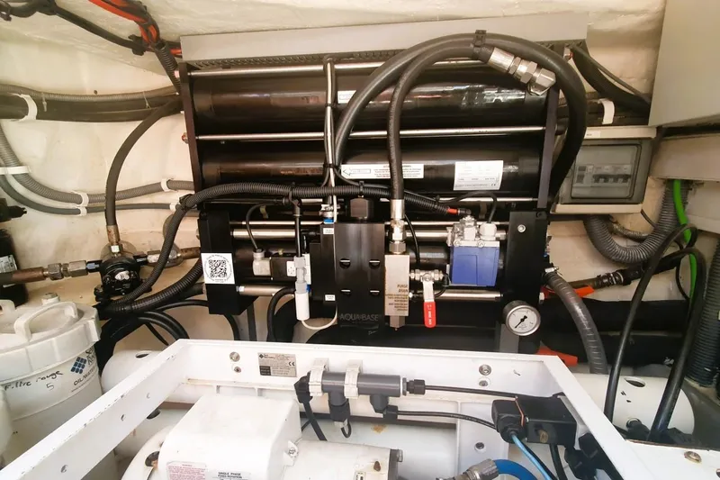 Sunnyacht Yacht Photos Pics Engine room of a 2008 Sunreef 62 yacht, showcasing complex machinery and wiring.