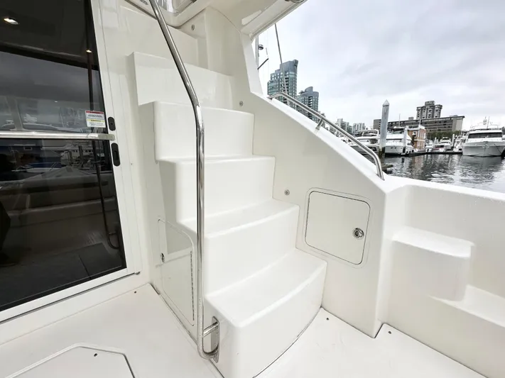  Yacht Photos Pics Staircase on 2012 Sea Ray 450 Sedan Bridge yacht, docked at marina.