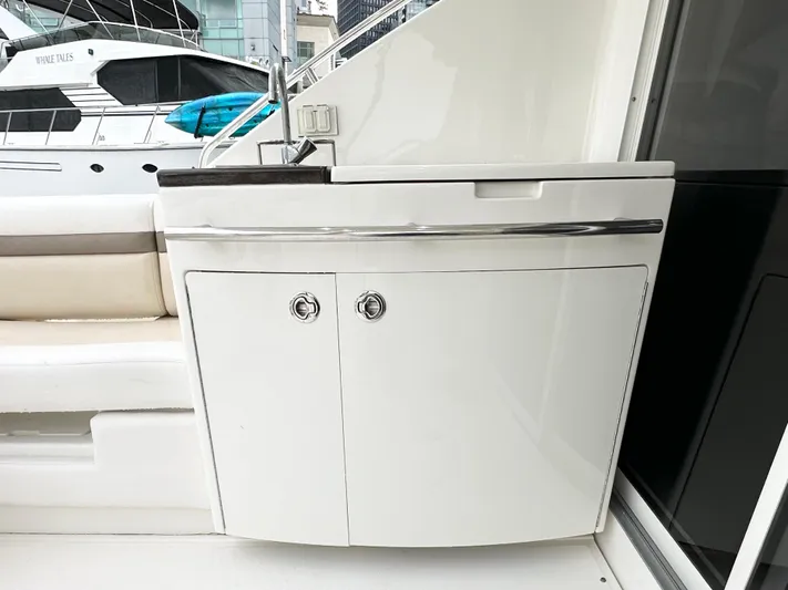  Yacht Photos Pics 2012 Sea Ray 450 Sedan Bridge yacht with sleek white cabinetry and modern design.