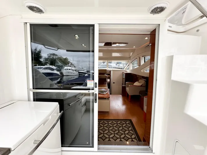  Yacht Photos Pics Interior view of 2012 Sea Ray 450 Sedan Bridge yacht with modern furnishings.