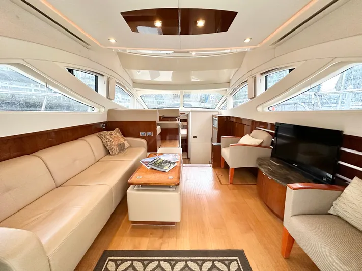 Yacht Photos Pics Luxurious interior of 2012 Sea Ray 450 Sedan Bridge yacht with elegant seating and modern amenities.