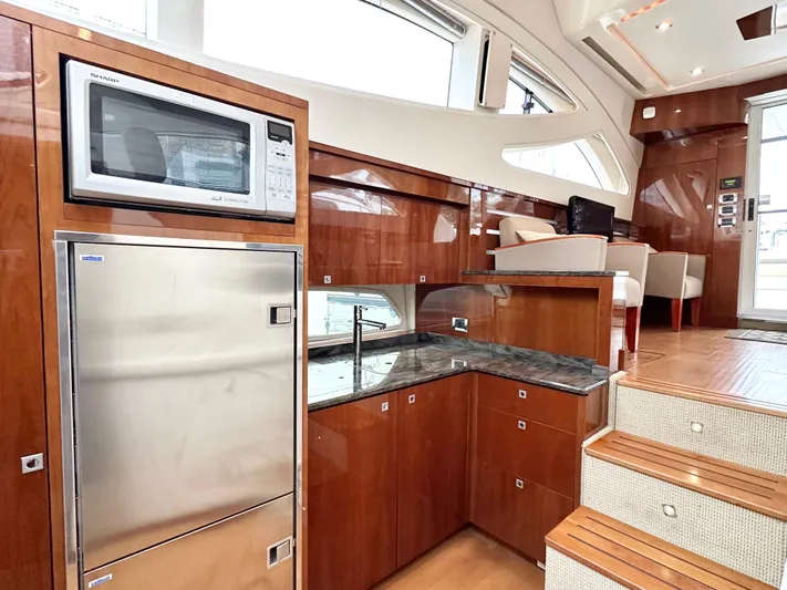  Yacht Photos Pics Luxurious interior of 2012 Sea Ray 450 Sedan Bridge yacht with modern kitchen amenities.