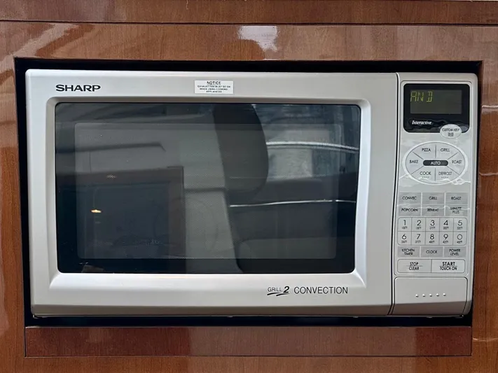  Yacht Photos Pics Sharp microwave oven in 2012 Sea Ray 450 Sedan Bridge yacht kitchen.