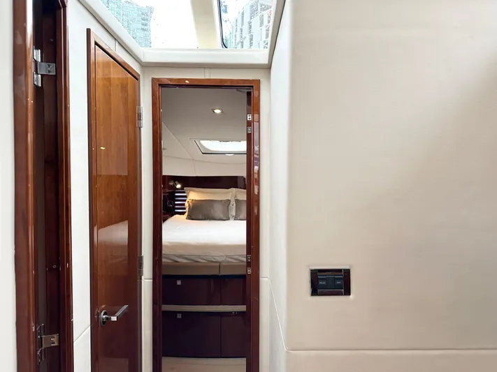  Yacht Photos Pics Interior view of 2012 Sea Ray 450 Sedan Bridge, featuring a cozy bedroom.