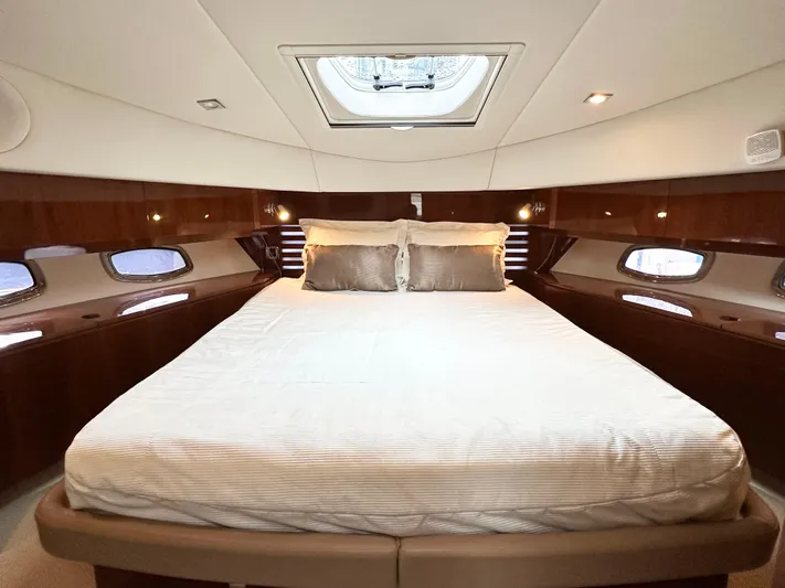 Yacht Photos Pics Luxurious bedroom interior of 2012 Sea Ray 450 Sedan Bridge yacht with skylight.