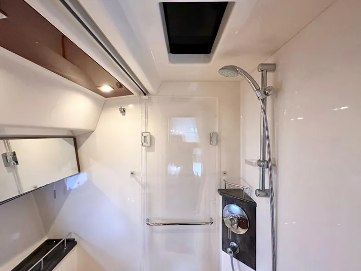  Yacht Photos Pics Luxurious bathroom interior of 2012 Sea Ray 450 Sedan Bridge yacht with modern shower amenities.