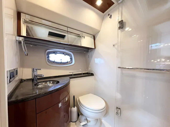  Yacht Photos Pics Luxurious bathroom in 2012 Sea Ray 450 Sedan Bridge yacht with modern fixtures.