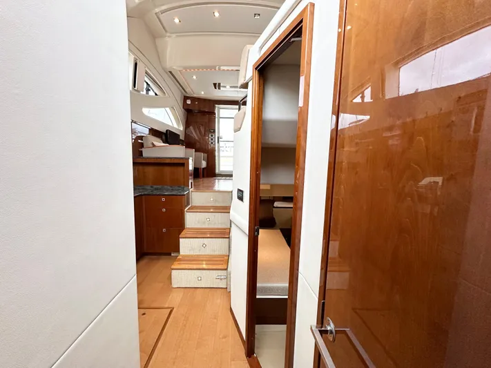 Yacht Photos Pics Interior view of 2012 Sea Ray 450 Sedan Bridge yacht with wooden finishes and modern design.